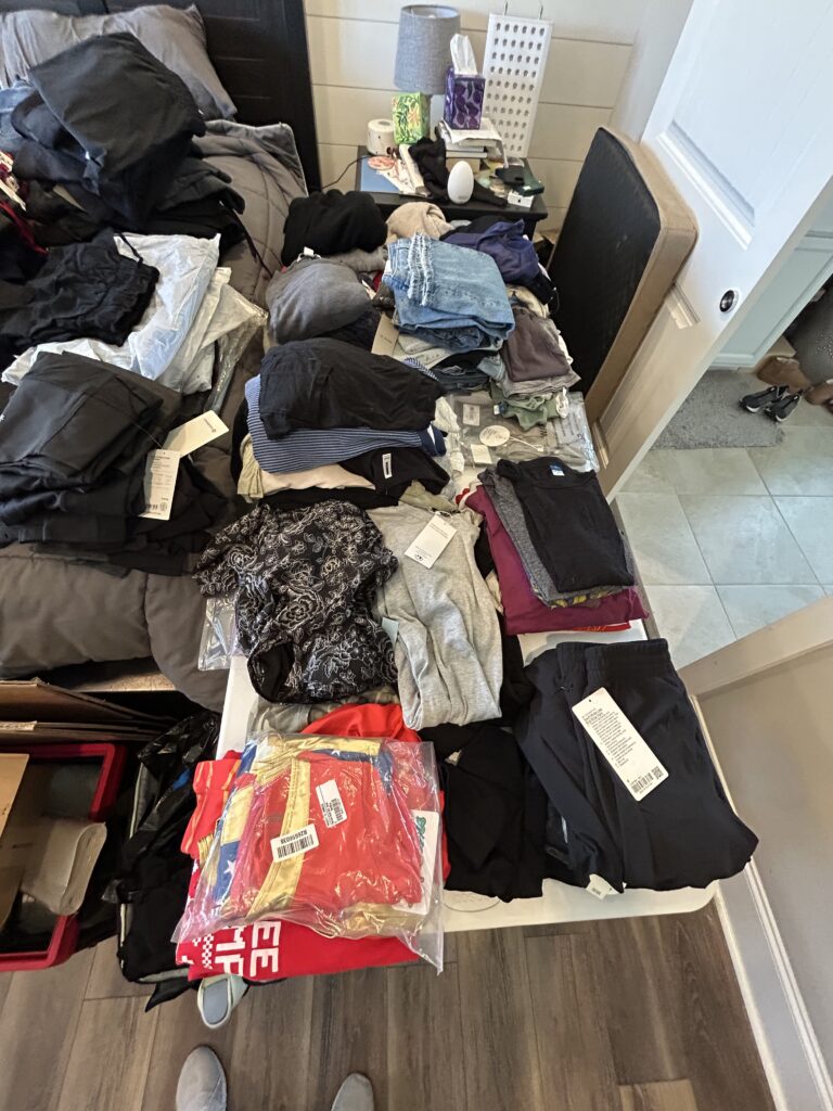 Simple Spaces assisting clients with home organizing through sorting clothing for decision making